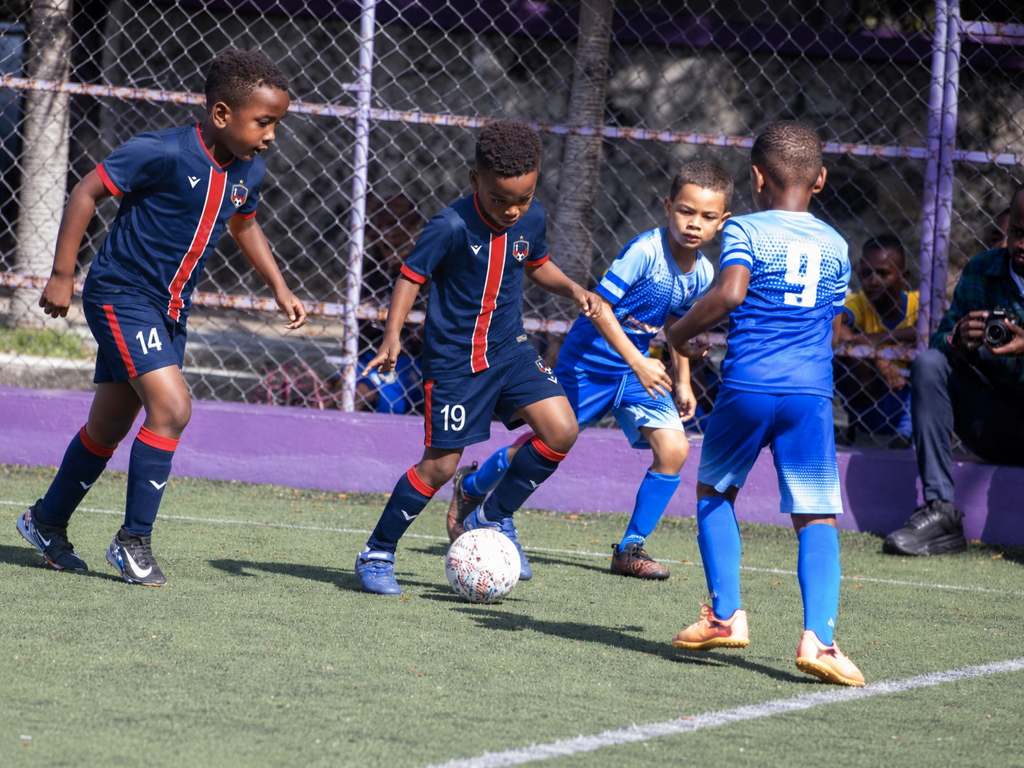 Students playing an active football match during the Frères program